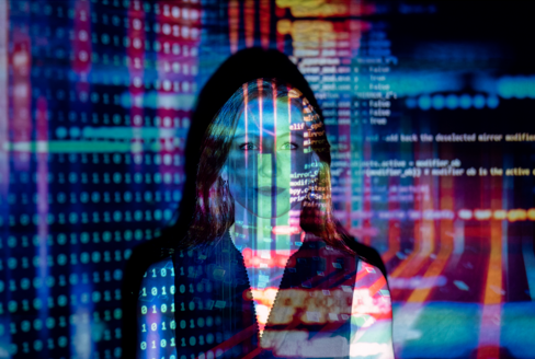 Woman smiling with a projected data overlay